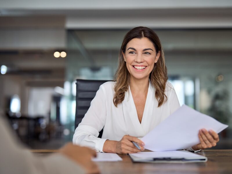 Smiling,Mature,Business,Woman,Hr,Holding,Cv,Document,At,Job